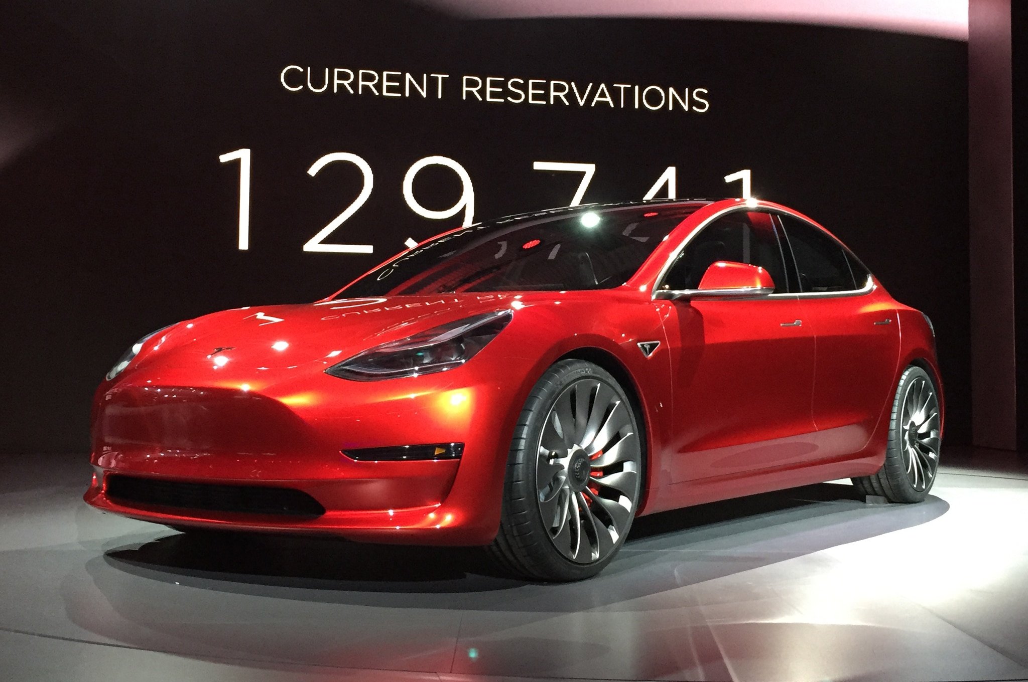 Tesla-Model-3-on-stage-in-red.jpg